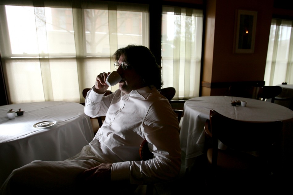 Chef Scott Carsberg takes a cappuccino break in the dining room at Lampreia before the evening dining. (Photo By:Scott Eklund/Red Box Pictures)