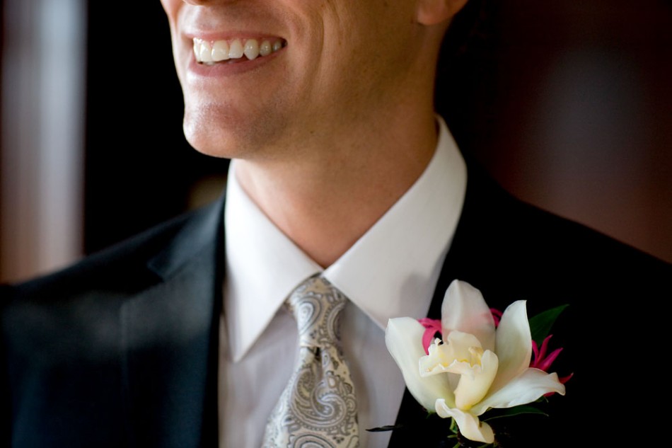 Boutonniere, tie and smile; all in place.