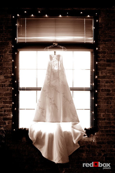 Michelle's dress hanging in the window at The Attic. (Photo By: Scott Eklund/Red Box Pictures)