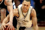 2006 P-I Sports Star of the Year UW's Brandon Roy dives for a loose ball and takes it away from Utah State's David Pak as the University of Washington beat Utah State in the first round of the 2006 NCAA Men's Basketball in San Deigo. (Scott Eklund/Seattle Post-Intelligencer)