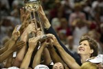 2004 SSY winner Seattle Storm Coach Anne Donovan reaches out to touch the championship trophy in 2004 as she became the first woman head coach to win the WNBA title. (Scott Eklund/Seattle Post-Intelligencer)