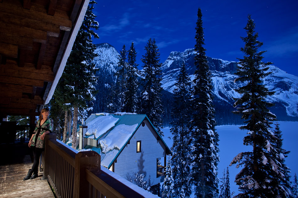 A guest enjoys the beauty of the full moon over Lake Louise at the Emerald Lake Lodge. (Photo by Andy Rogers/Red Box Pictures)