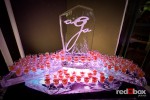 A sculpture by Illustrations in Ice shows off shots of ceviche by A Grand Affaire Catering at their Winter Open House at Georgetown Studios in Seattle. (Photo by Red Box Pictures)