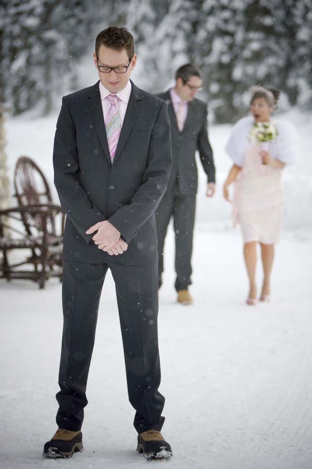Karen walks up behind Steve for their first sighting on their wedding day. (Photography by Scott Eklund/Red Box Pictures)