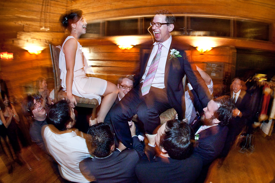 Steve and Karen are lifted on chairs by their friends as they dance and celebrate during the reception at Emerald Lake Lodge in Yoho National Park, Canada. (Photo by Andy Rogers/Red Box Pictures)