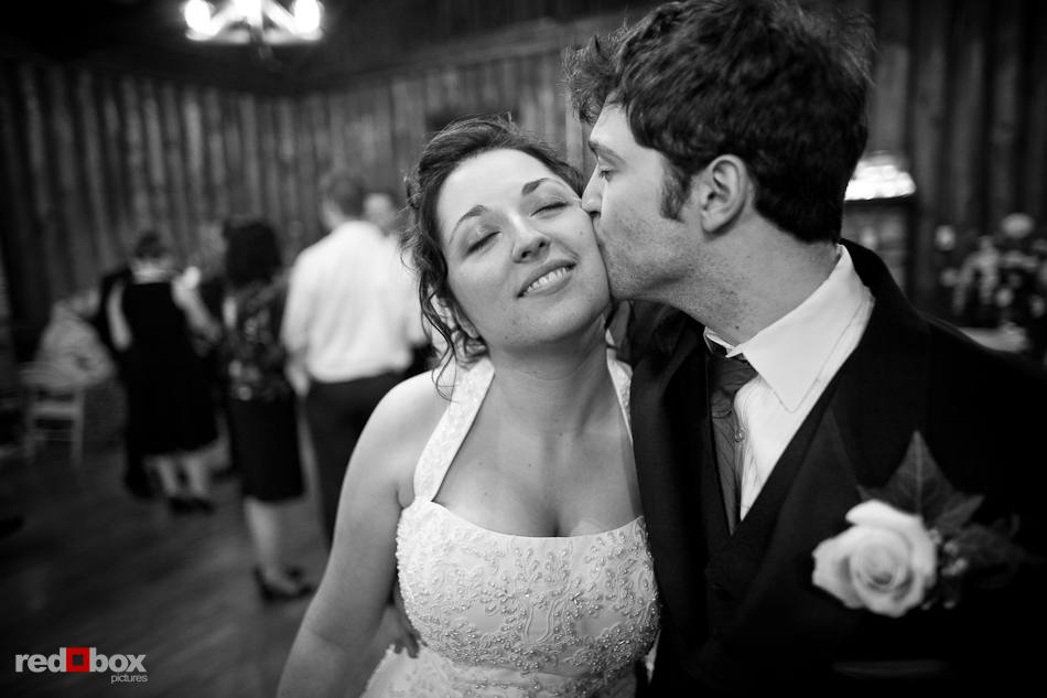 Marilee gets a kiss from her brother after her wedding ceremony at Hillcrest Lodge in Mt. Vernon, WA. (Photography by Andy Rogers/Red Box Pictures)