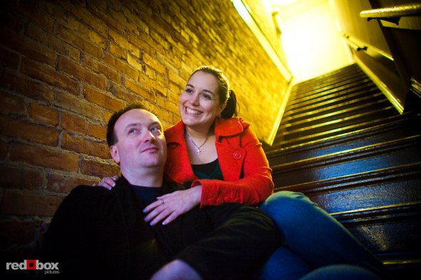 During their old Ballard engagement portrait, Brian and Tara sit in an apartment stairwell. (Photography by Andy Rogers/Red Box Pictures)