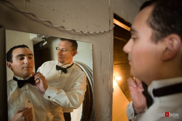Kris get some help with his bow tie prior to his wedding at the Lake Union Cafe in Seattle. (Photo by Rob Sumner/Red Box Pictures)