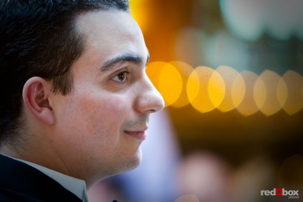 Kris stands during his wedding ceremony at the Lake Union Cafe in Seattle. (Photo by Andy Rogers/Red Box Pictures)
