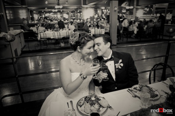 Sarah and Kris enjoy their meal at the Lake Union Cafe following their wedding ceremony in Seattle. (Photo by Andy Rogers/Red Box Pictures)