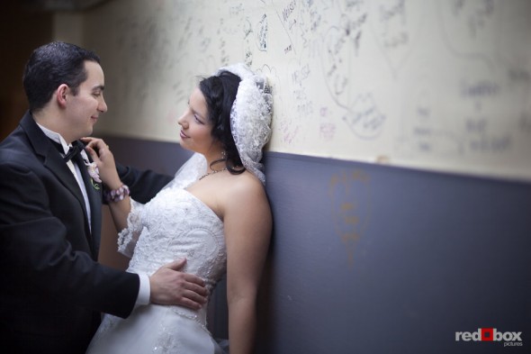 Sarah and Kris in the basement hallway of the Lake Union Cafe after their wedding ceremony in Seattle. (Photo by Rob Sumner/Red Box Pictures)