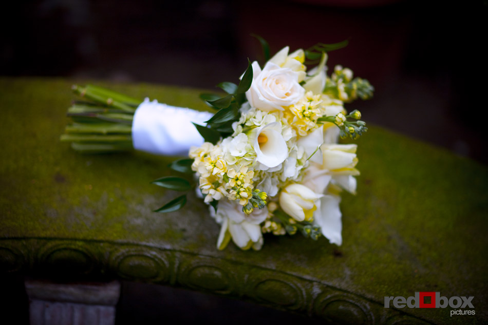 The Bride's bouquet rest on this bench at the Beacon Mansion in Seattle on Capitol Hill. Wedding Photography: Scott Eklund/Red Box Pictures