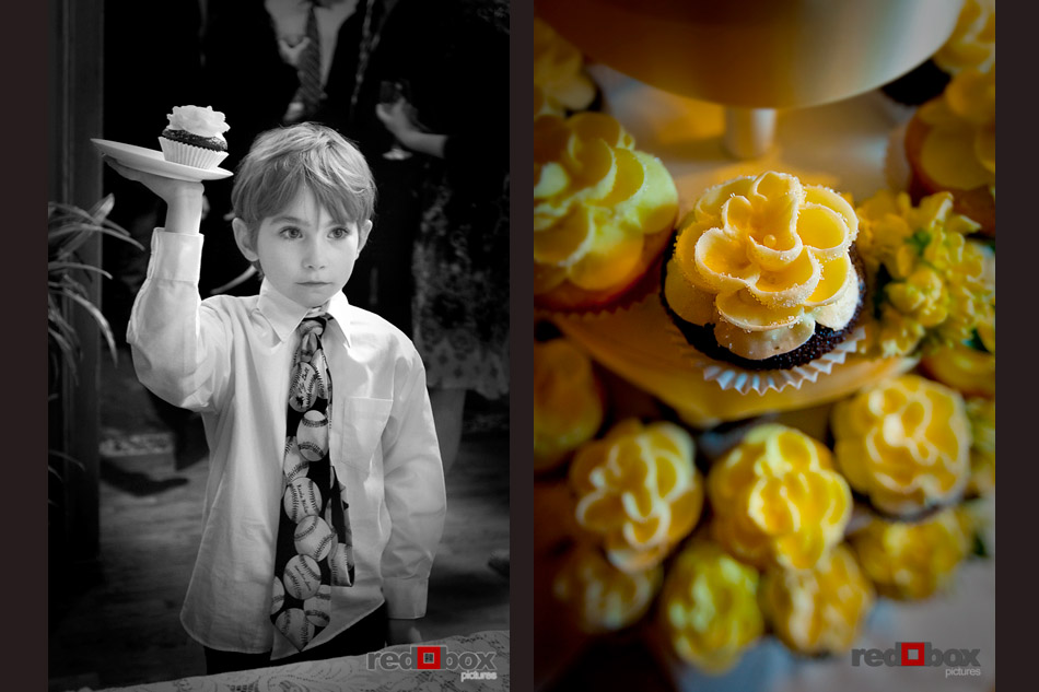 This little boy holds up a cupcake during the reception at the Seattle wedding at the Bacon Mansion on Capitol Hill. Wedding photography by Red Box Pictures/Scott Eklund
