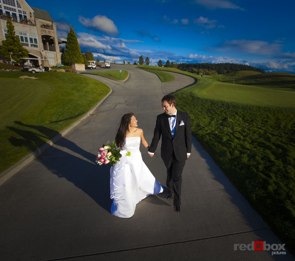 The bride and groom go for a walk at The Golf Club at Newcastle on their wedding day. (Photography by Scott Eklund/Red Box Pictures)