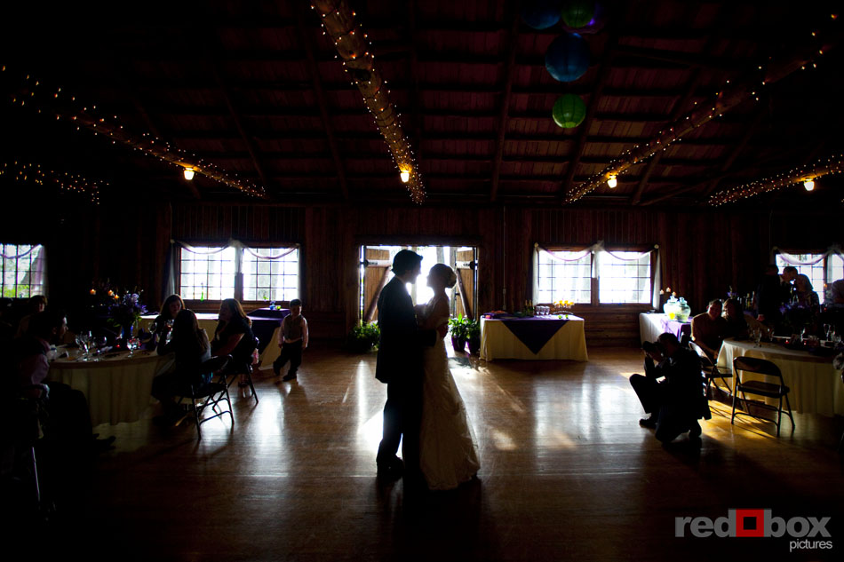 The bride & groom dance inside the cabin at their Kitsap Memorial State Park wedding in Poulsbo, WA. Seattle Wedding Photographers Red Box Pictures Scott Eklund