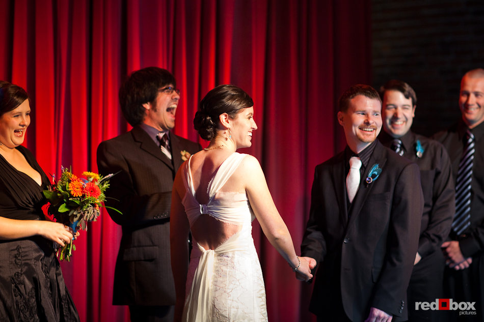 Niki and Shawn laugh with their friends during their ceremony at the Georgetown Ballroom in Seattle. (Photo by Dan DeLong/Red Box Pictures)
