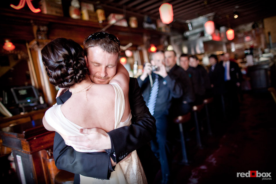 Niki and Shawn see each other in their wedding day finery for the first time at Jules Maes Saloon in Georgetown neighborhood of Seattle. (Photography by Andy Rogers/Red Box Pictures)