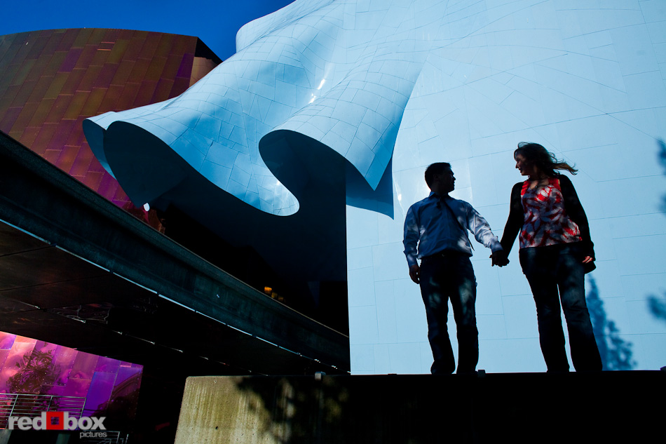 Jenny and Eugene stand outside the Experience Music Project during their engagement session at Seattle Center Friday, June 11, 2010. (Photo by Andy Rogers/Red Box Pictures)