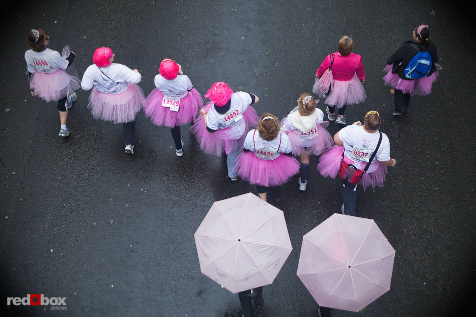 Pink tutu clad participants move down Mercer Street during the co-ed 5K walk at the 2010 Susan G. Komen Race for the Cure in Seattle on June 6, 2010. (Photography by Andy Rogers/Red Box Pictures)