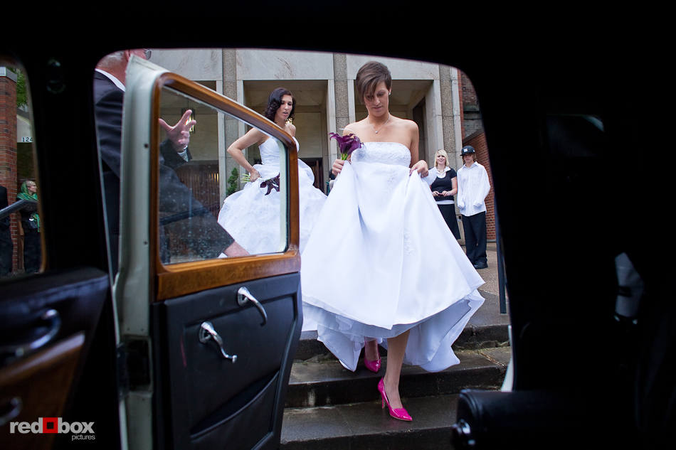 Rebecca and Kirsten leave in a car from Thomsen Chapel at St. Mark's Cathedral following their wedding in Seattle on Saturday, May 22, 2010. (Photography by Andy Rogers/Red Box Pictures)