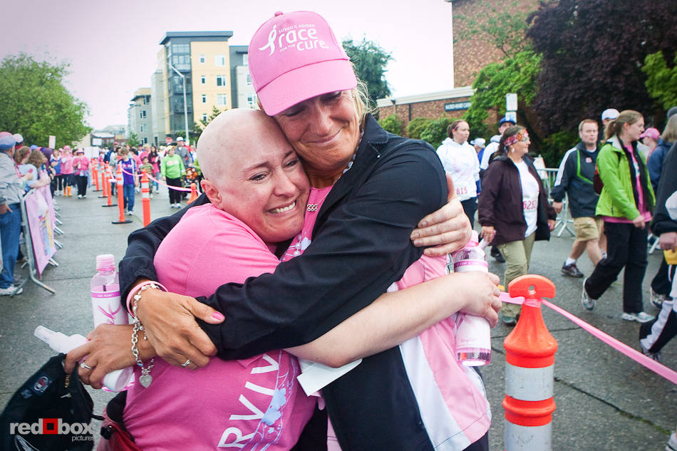 Breast cancer survivors embrace after completing the 2010 Susan G. Komen Race for the Cure in Seattle on Sunday, June 6, 2010. (Photo by Dan DeLong/Red Box Pictures)