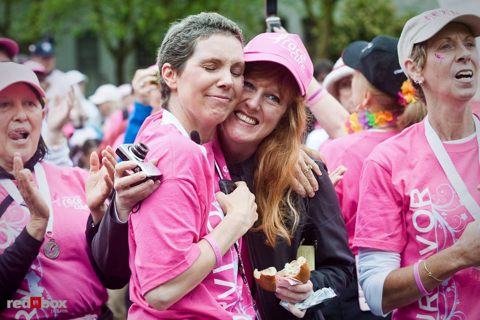 Breast cancer survivors listen to the closing ceremonies during the 2010 Susan G. Komen Race for the Cure in Seattle on Sunday, June 6, 2010. (Photo by Dan DeLong/Red Box Pictures)