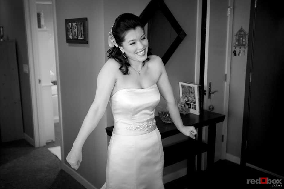 The bride is anxious and excited before her wedding at St. Louise Catholic Church in Bellevue. (Wedding Photographer Scott Eklund Red Box Pictures)