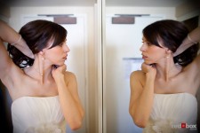 Kate puts on her necklace while getting ready for her wedding to Dan at the Sheraton in downtown Seattle. (Photo by Dan DeLong/Red Box Pictures)