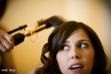 Kate chats with bridesmaids while her hair is curled on her wedding day at Sheraton Seattle Hotel. (Photo by Dan DeLong/Red Box Pictures)
