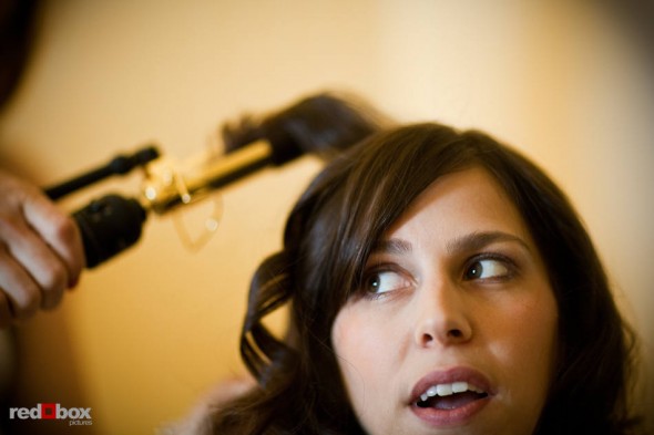 Kate chats with bridesmaids while her hair is curled on her wedding day at Sheraton Seattle Hotel. (Photo by Dan DeLong/Red Box Pictures)
