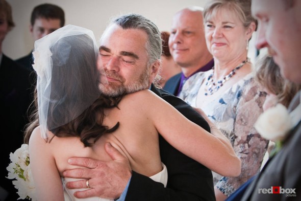 Kate hugs her father during her wedding to Dan at the Engine Room @ Georgetown Studios in Seattle. (Photography by Andy Rogers/Red Box Pictures)