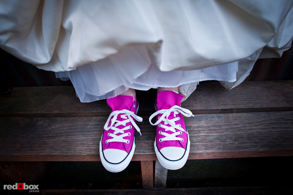 Maureen dons her pink chucks for added comfort during her wedding at the Georgetown Ballroom in Seattle. (Photo by Andy Rogers/Red Box Pictures)