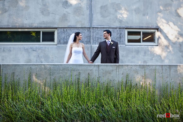 Bride Laura and groom Nathan pose outside the Novelty Hill Januik Winery in Woodinville before their wedding. (Photo by Dan DeLong/Red Box Pictures)