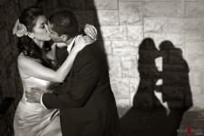 Neel & Johnna share a kiss at the Golf Club at Newcastle after their wedding. (Seattle Wedding Photographer Scott Eklund Red Box Pictures)