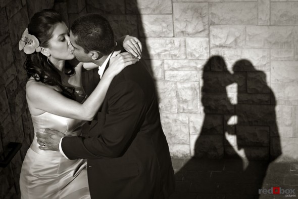 Neel & Johnna share a kiss at the Golf Club at Newcastle after their wedding. (Seattle Wedding Photographer Scott Eklund Red Box Pictures)