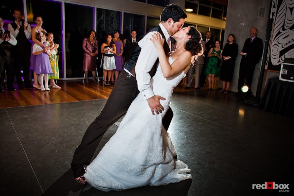 Nathan dips Laura at the conclusion of their first dance during their wedding reception at the Novelty Hill Januik Winery in Woodinville, WA. (Photo by Dan DeLong/Red Box Pictures)