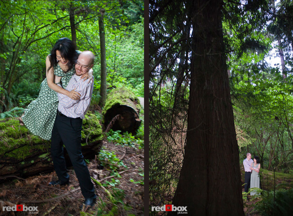 Rory helps Nobuyo jump down from a log and the couple stand among the trees in Seward Park during their engagement portrait session in Seattle. (Photography by Andy Rogers/Red Box Pictures)