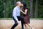 Nobuyo and Rory take a break from swinging during their engagement portrait session at Seward Park in Seattle. (Photography by Andy Rogers/Red Box Pictures)