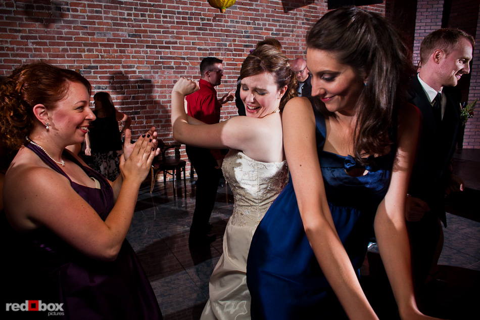 Maureen dances with her friends during her wedding at the Georgetown Ballroom in Seattle. (Photo by Andy Rogers/Red Box Pictures)