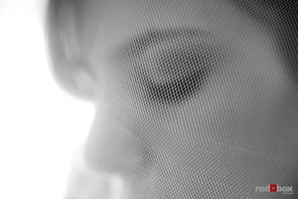 Kate puts on her veil while getting ready for her wedding at the Sheraton Hotel in Seattle. (Photo by Dan DeLong/Red Box Pictures)