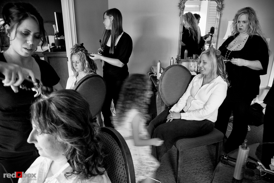 Rachel, her bridesmaids and family have their hair styled for her wedding ceremony in a suite at the Woodmark Hotel in Kirkland, WA. (Photography by Andy Rogers/Red Box Pictures)