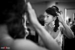Nobuyo puts on her earrings after having her hair and makeup done at Adore in Seattle prior to her Virginia V wedding. Photo by Seattle wedding photographer Andy Rogers of Red Box Pictures.