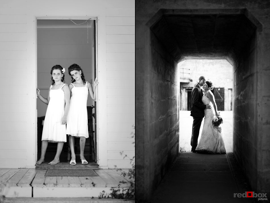 The two flower girls stand in the doorway as the bride & groom kiss during their wedding at Greenbank Farms on Whidbey Island, Wash. (Wedding Photography Scott Eklund Red Box Pictures Seattle)