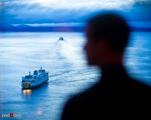 A guests enjoys an amazing view of ferries in Elliott Bay from the wedding reception at The Harbor Club Seattle Saturday. (Photos by Andy Rogers/Red Box Pictures)