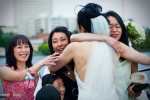 Friends give hugs of congratulations to Nobuyo after she married Rory aboard the Virginia V steamship on Lake Union in Seattle. (Photo by Dan DeLong/Red Box Pictures)
