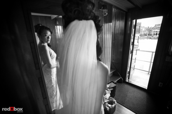 Nobuyo checks the mirror aboard the Virginia V prior to her wedding ceremony and recpetion. Photo by Seattle wedding photographer Andy Rogers of Red Box Pictures.