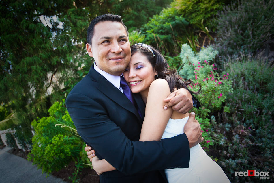 Anghi gets a hug from his brother before she married Andy at The Canal in Seattle. (Photo by Dan DeLong/Red Box Pictures)
