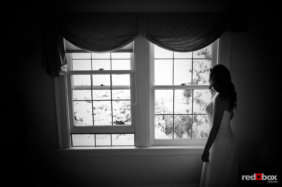 Anghi, the bride, waits for her groom, Andy, to arrive before their wedding at The Canal in Seattle. (Photo by Dan DeLong/Red Box Pictures)