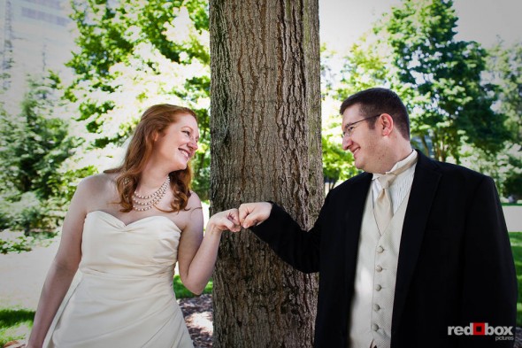Bride Katherine and her groom Bryan have fun during a portrait session in Freeway Park, Seattle. (Photo by Dan DeLong/Red Box Pictures)