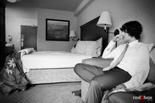 Andy, the groom, is deep in thought in his Seattle hotel room before his wedding to Anghi at The Canal. (Photo by Dan DeLong/Red Box Pictures)